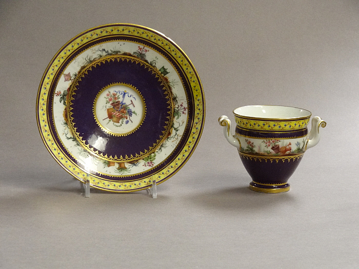 Two-Handled Cup and Saucer Slider Image 1
